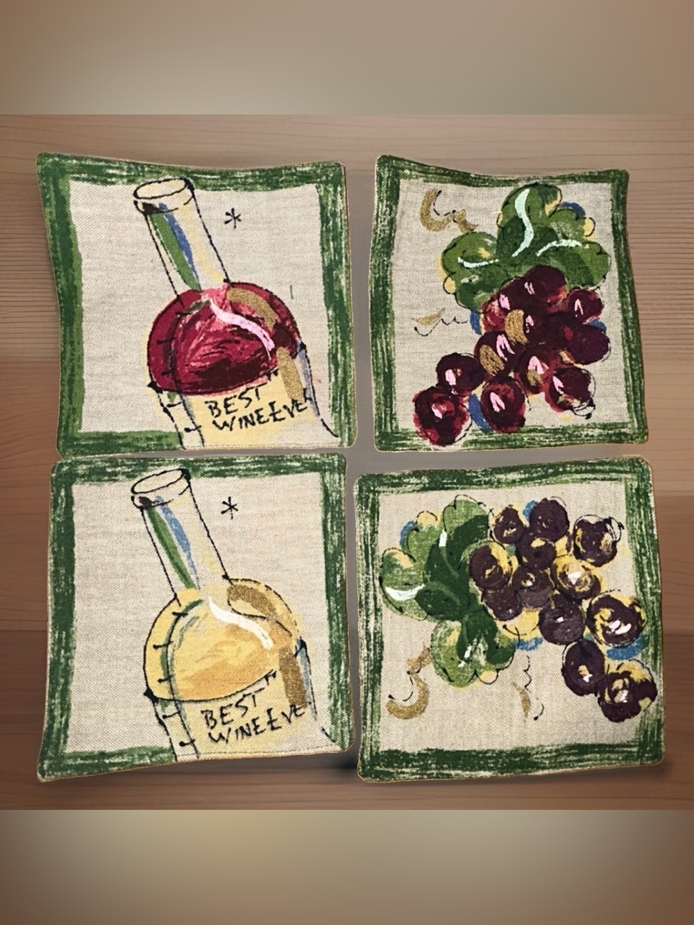This set of 4 cloth coasters by Western Linen Inc. features a wine motif in a co
